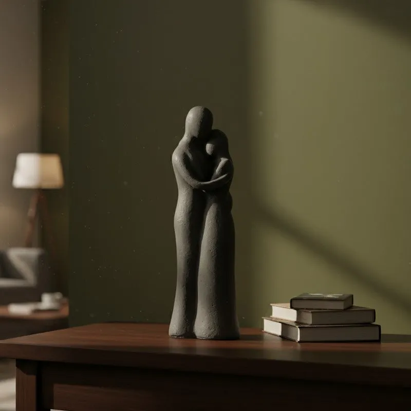 Grey abstract figurine showpiece styled on a dark wooden desk