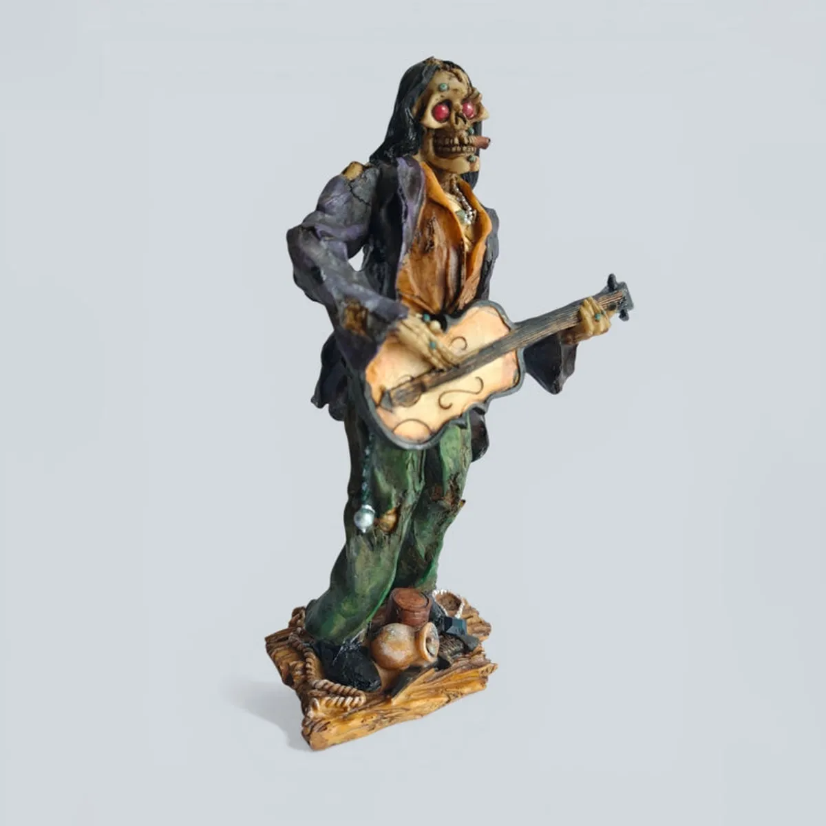 Side view of the zombie guitarist showpiece holding a guitar