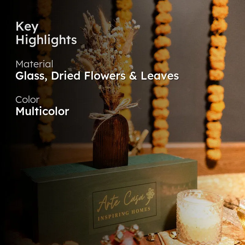Amber vase with dried flowers styled on a festive table setting
