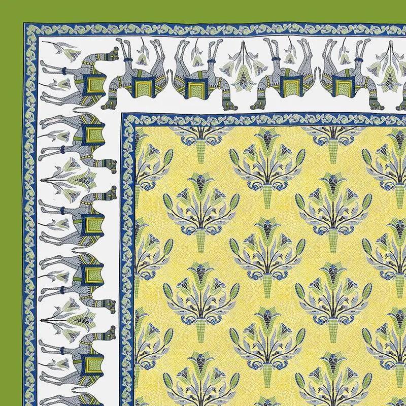 Close-up of floral yellow bedsheet with blue border and elephant motif