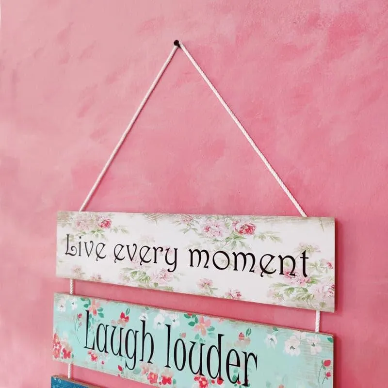 Close view of floral quote panels on a multicolour wall hanging