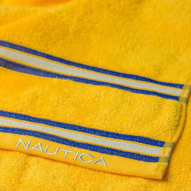 Close-up of yellow towel with blue and white striped border