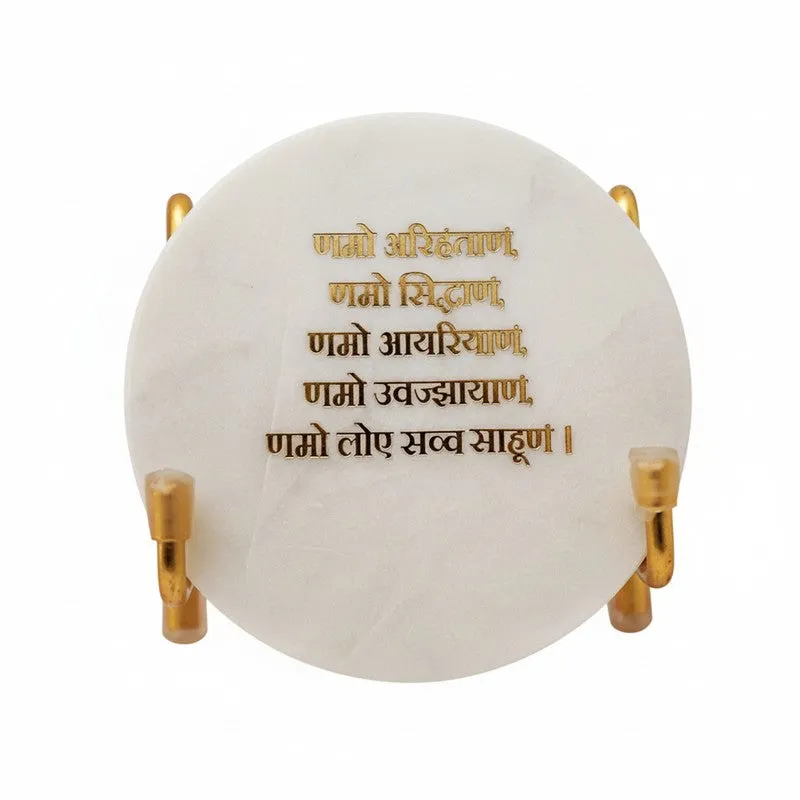 Front view of round white marble showpiece with script detail
