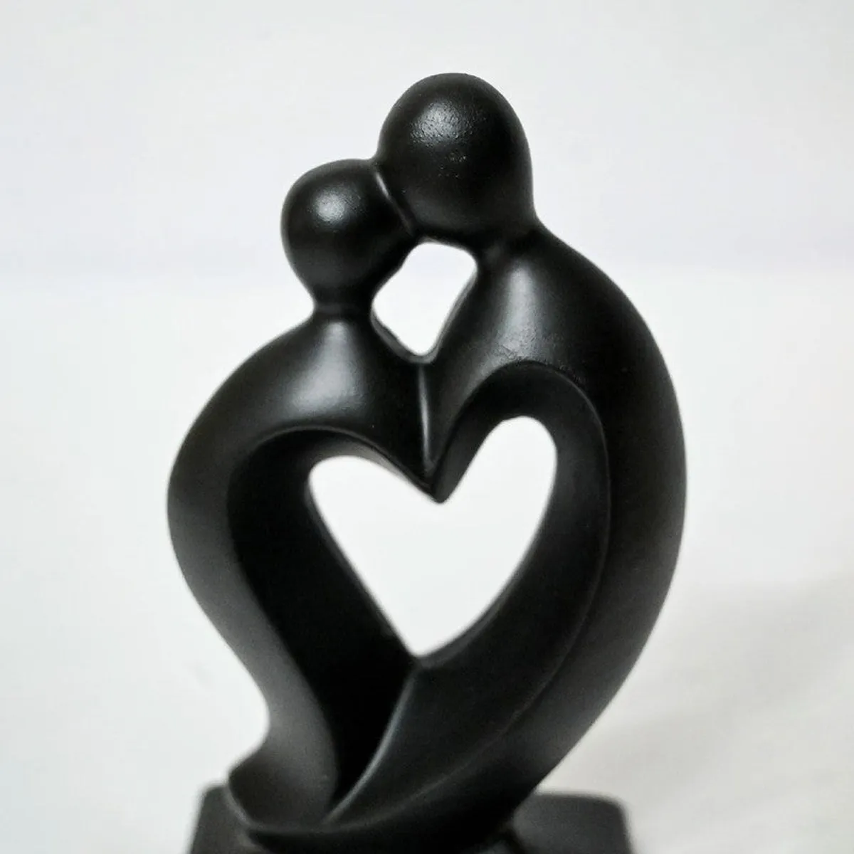 Close-up of the black abstract couple showpiece with heart-shaped cutout