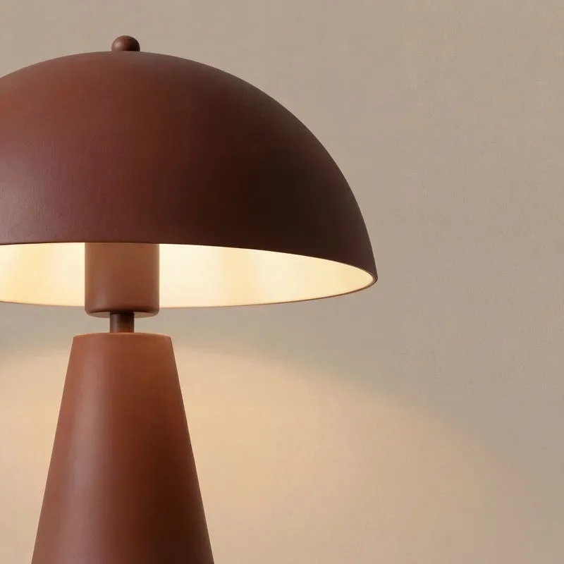 Close-up of the brown dome shade and upper stem of the table lamp