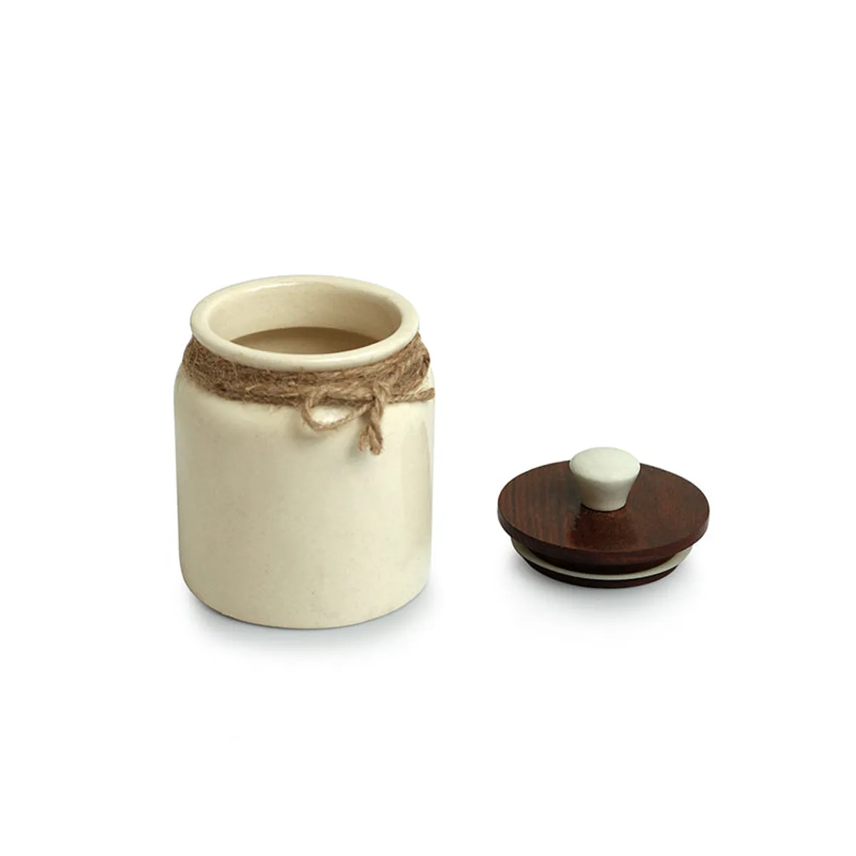 Open ceramic jar with its brown wooden lid placed beside it