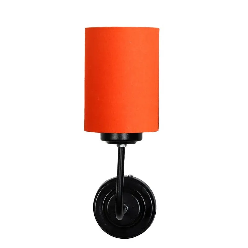 Front view of orange cylindrical wall lamp with black wall mount