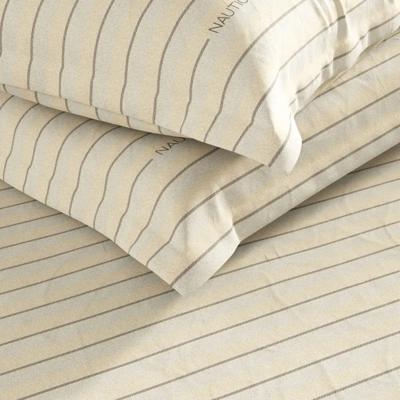 Folded brown striped bedsheet with matching pillow covers