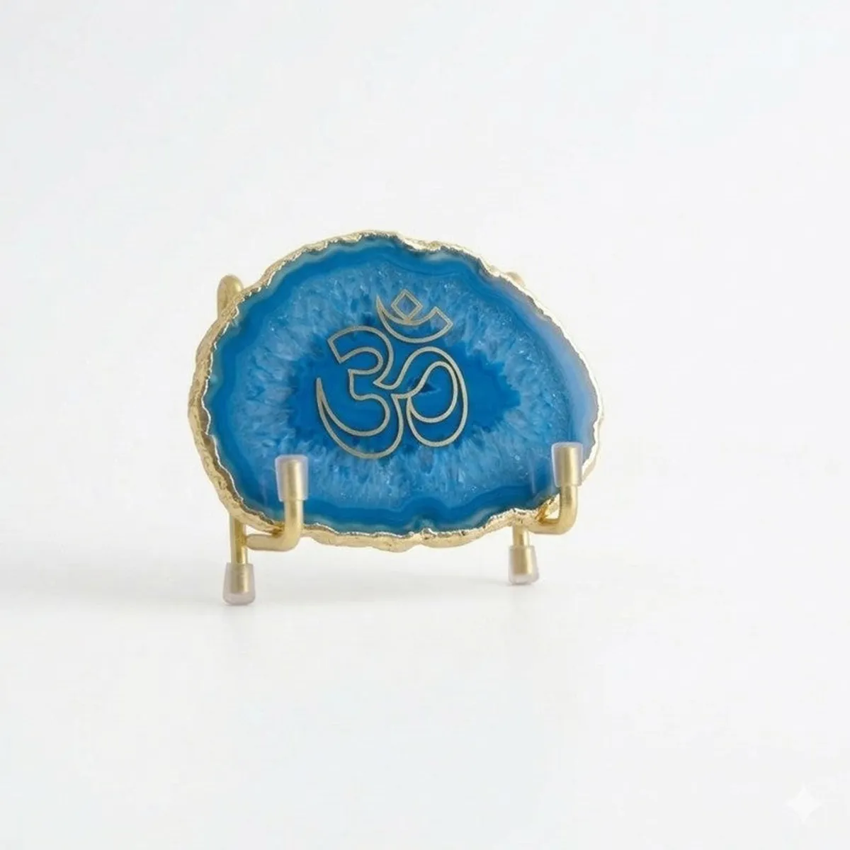 Blue agate religious accent with Om symbol against a white background