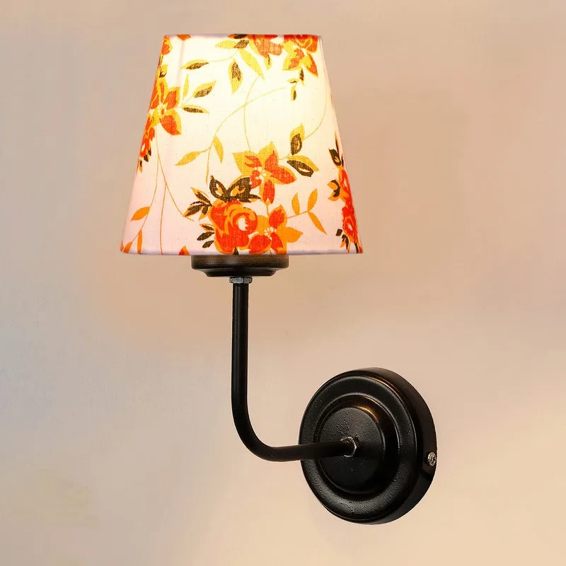 Front view of wall lamp with floral white shade and black iron base