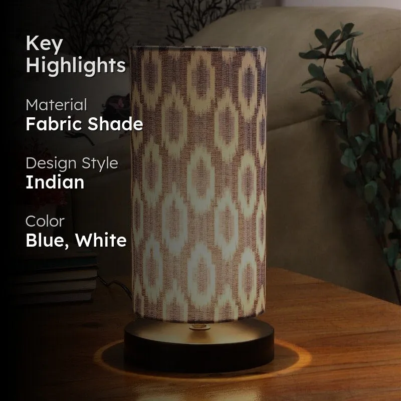 Lit blue and white patterned table lamp with text overlay highlighting material and colour