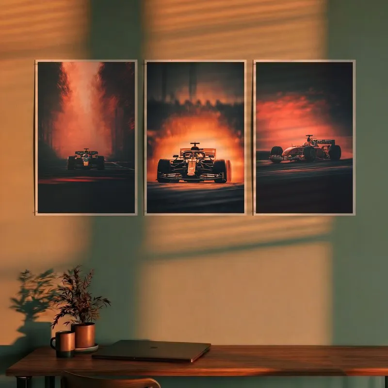 Set of three racing car wall posters displayed above a desk