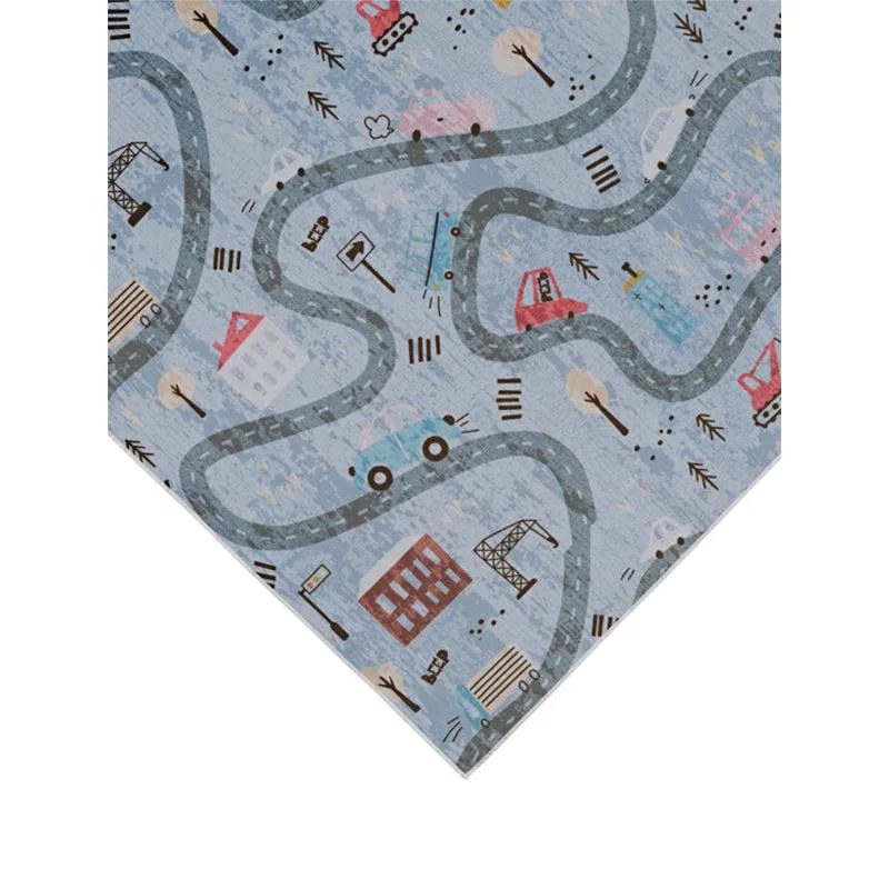 Angled close-up of blue carpet corner with road and vehicle pattern
