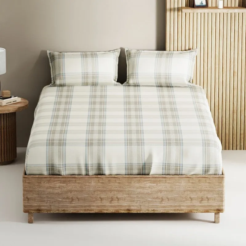 Front view of a blue and cream checked bedsheet with two matching pillows