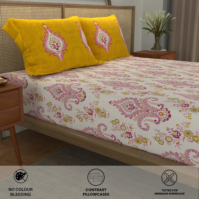 Angled view of the yellow and pink bedsheet set with contrast pillow covers