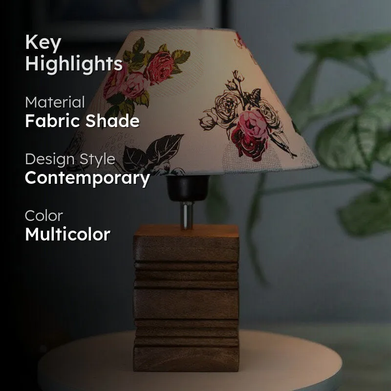Lit floral table lamp in a darkened room with highlight text overlay
