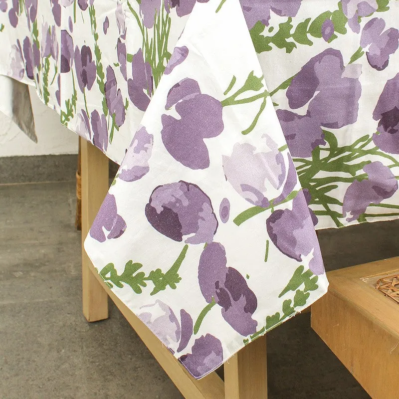 Close-up of the purple floral print and draped edge
