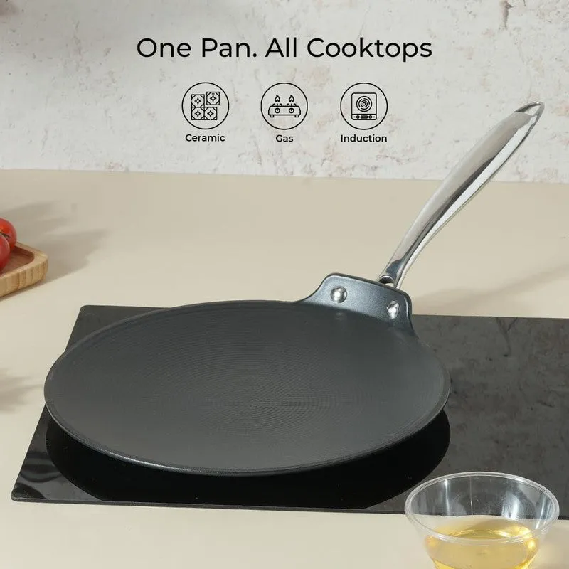 Black roti tawa shown on a cooktop with gas and induction icons