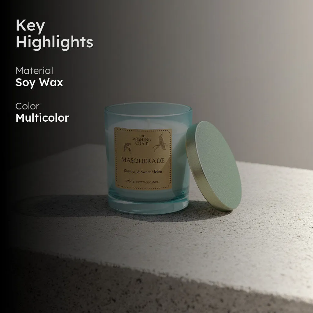 Aqua glass candle with metallic lid on a stone surface