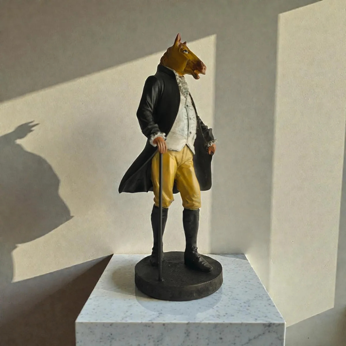 Horse-headed gentleman showpiece in warm sunlight on a pedestal