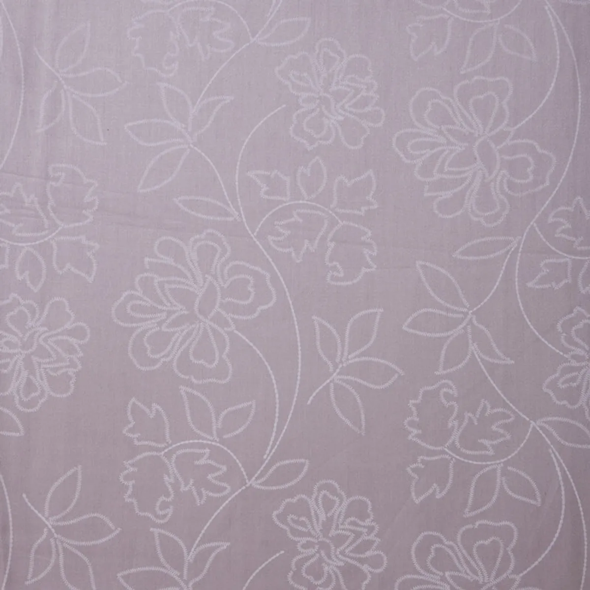 Close-up of the delicate floral pattern across pink-lavender fabric