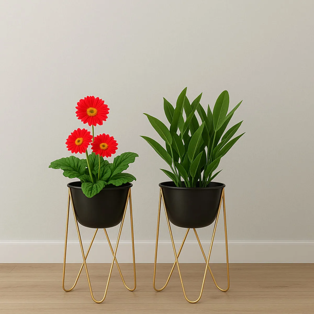 Two black metal planters with gold stands and green plants