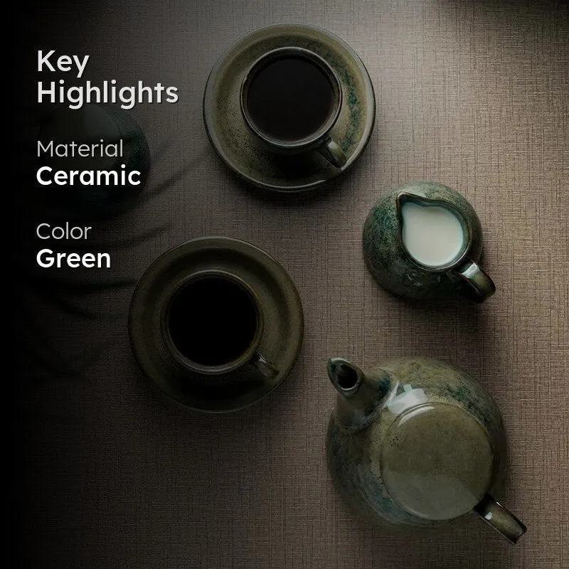 Green ceramic tea set arranged on a tabletop