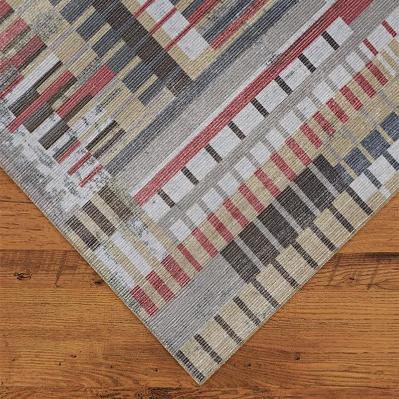 Close-up of the carpet corner showing the abstract striped pattern