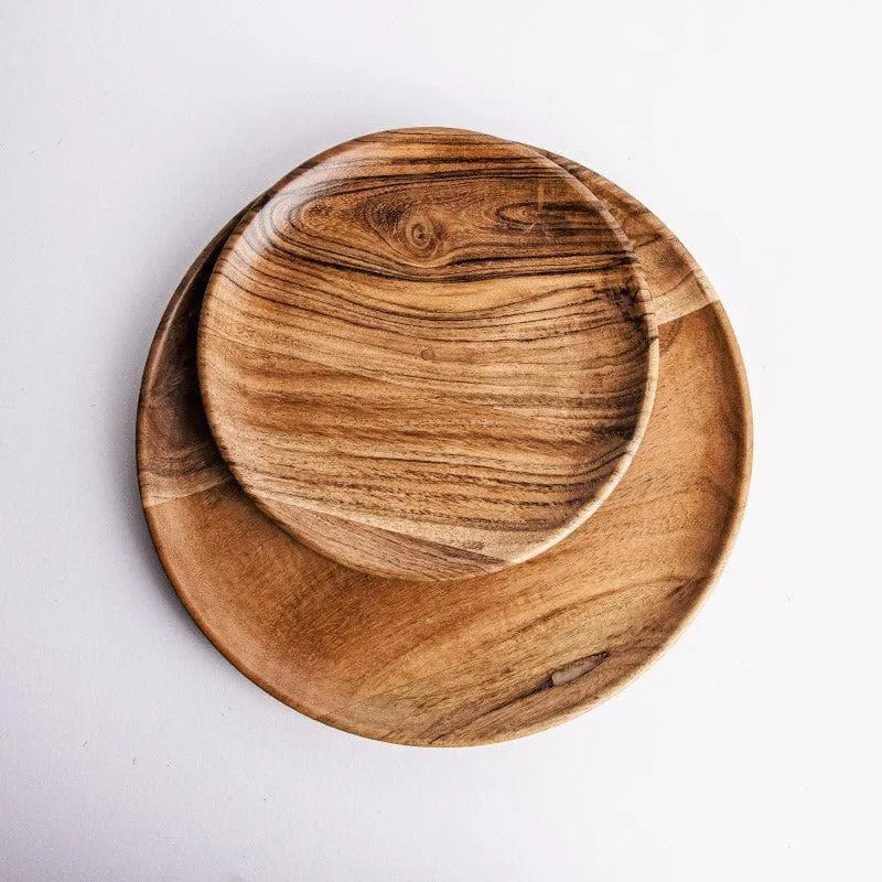 Two overlapping brown wooden plates showing rounded edges and natural grain