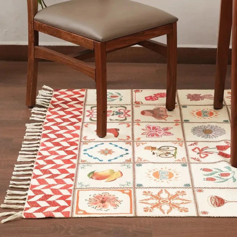 Corner view of multicolour fringed carpet placed beneath a wooden chair