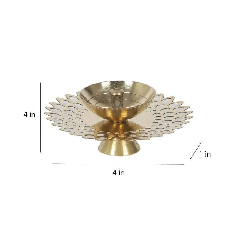 Side view of gold brass diya with round cutwork base