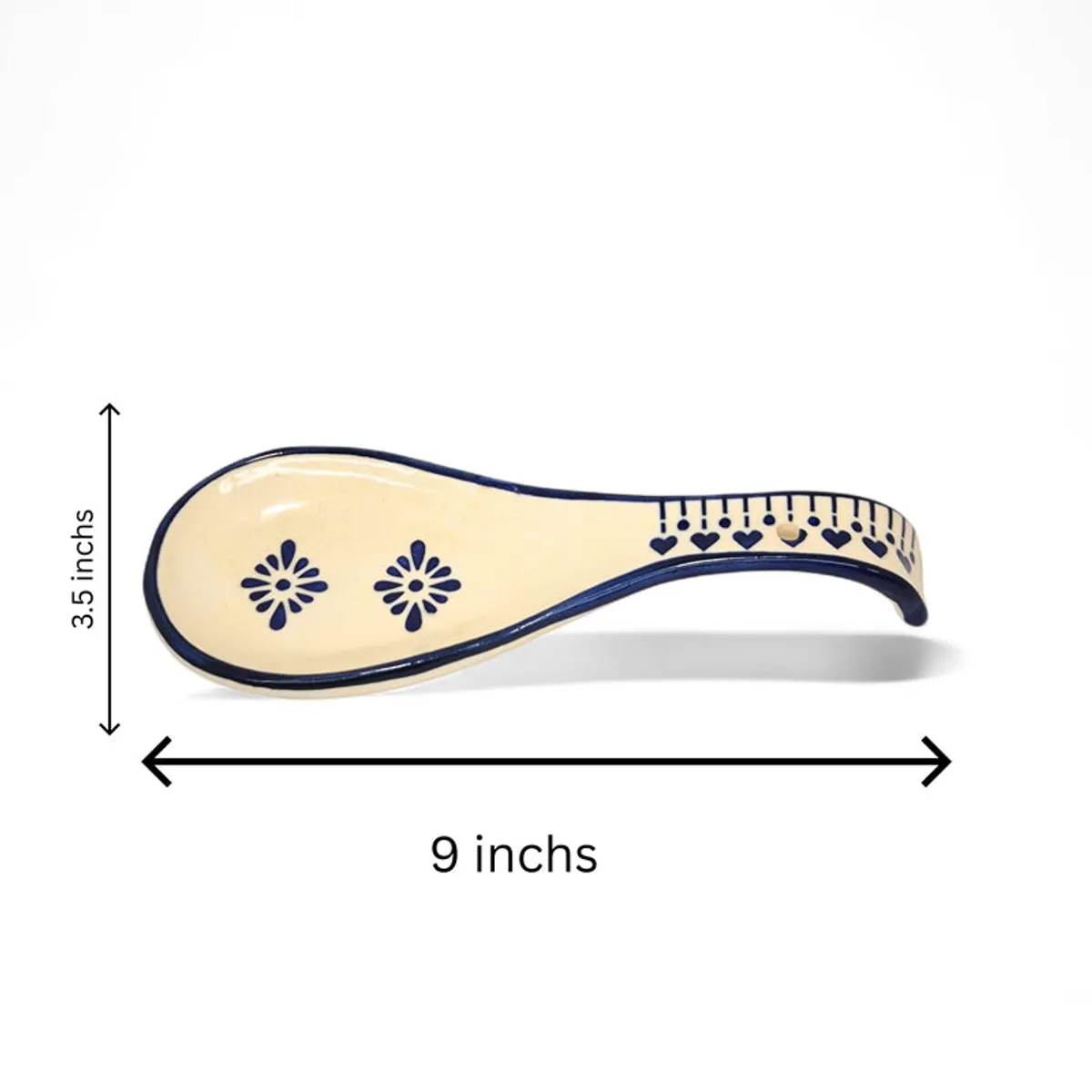 Single blue and white ceramic spoon rest shown with visible curved shape and floral motifs.