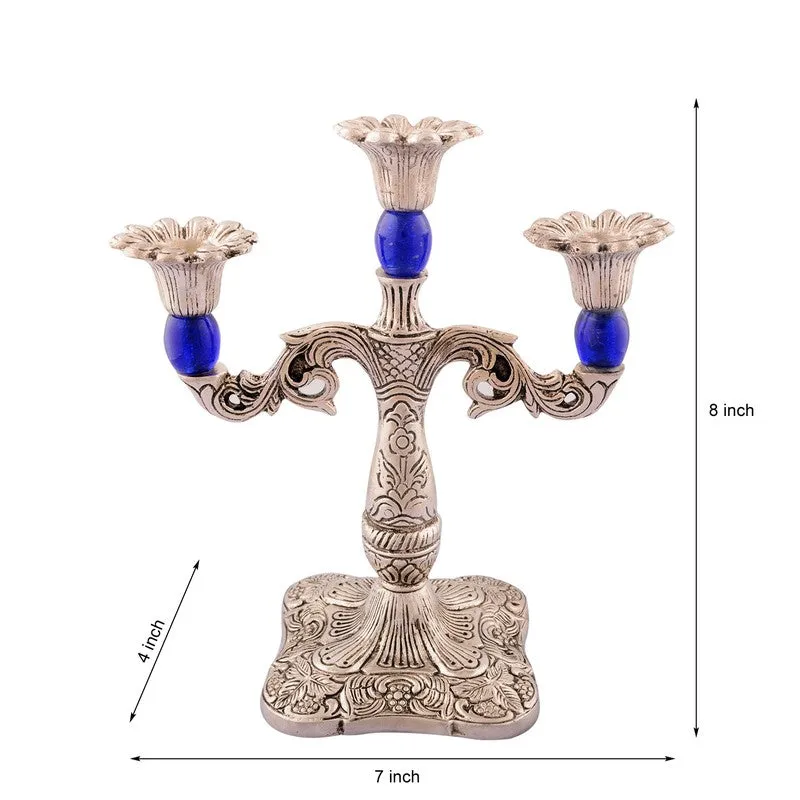 Ornate silver-toned candle holder with blue accents and size arrows