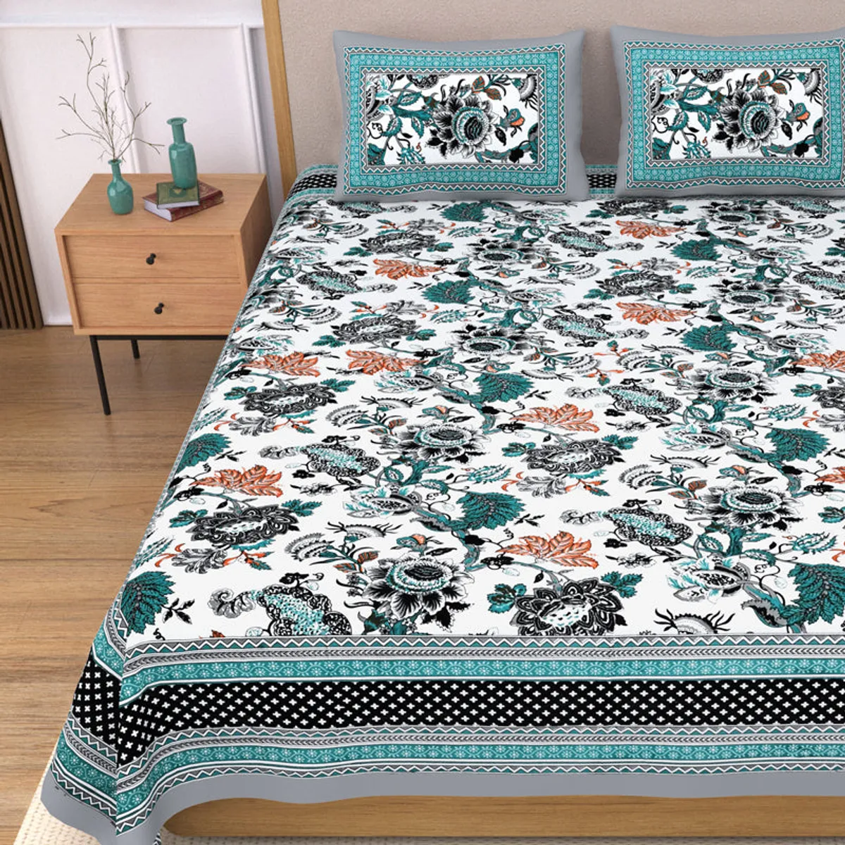 Close view of the floral bedsheet and border with matching pillows