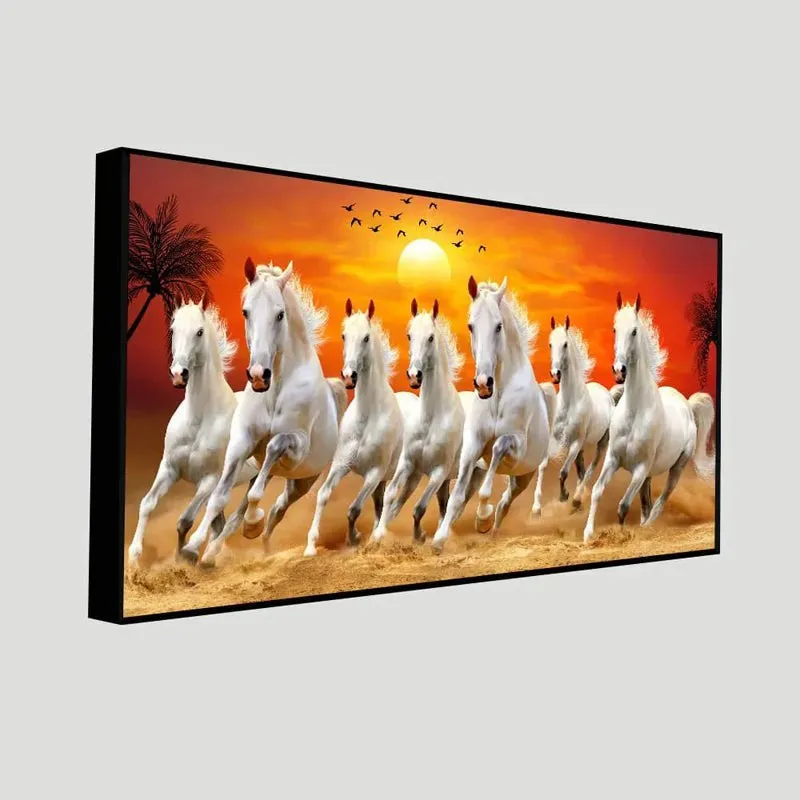 Angled view of framed canvas wall art with white horses and orange sunset background