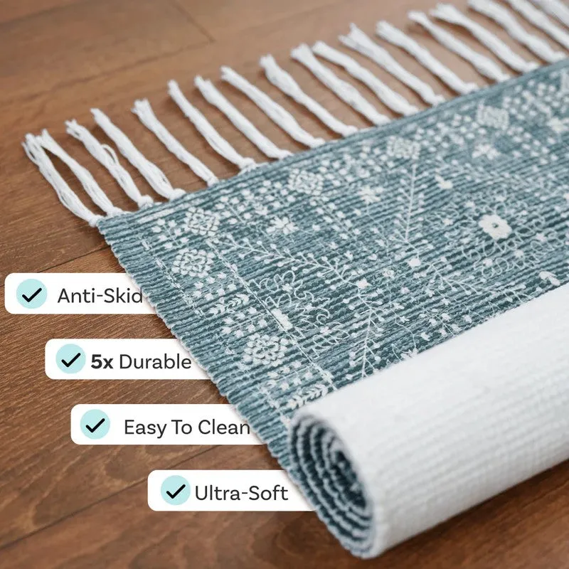 Rolled blue runner rug showing white anti-skid underside