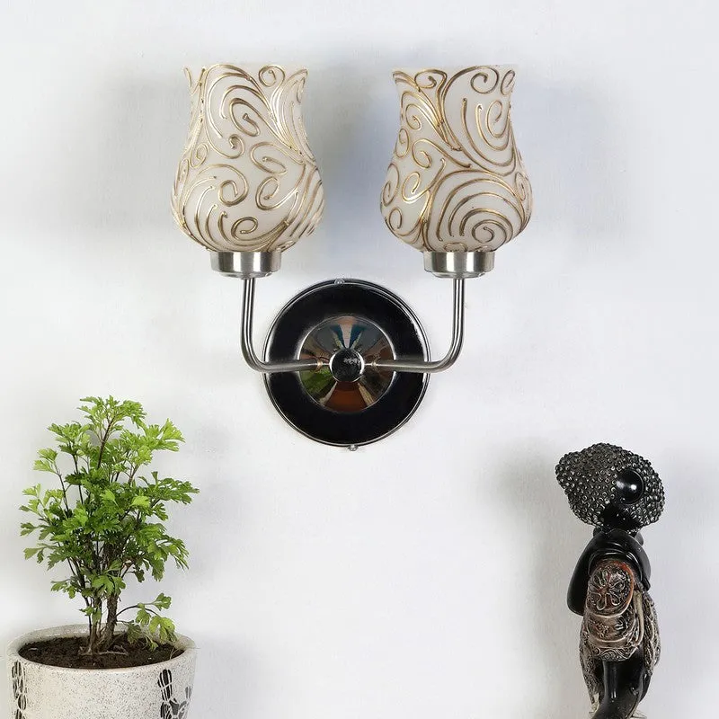 White and gold dual glass wall lamp with steel base mounted on a wall