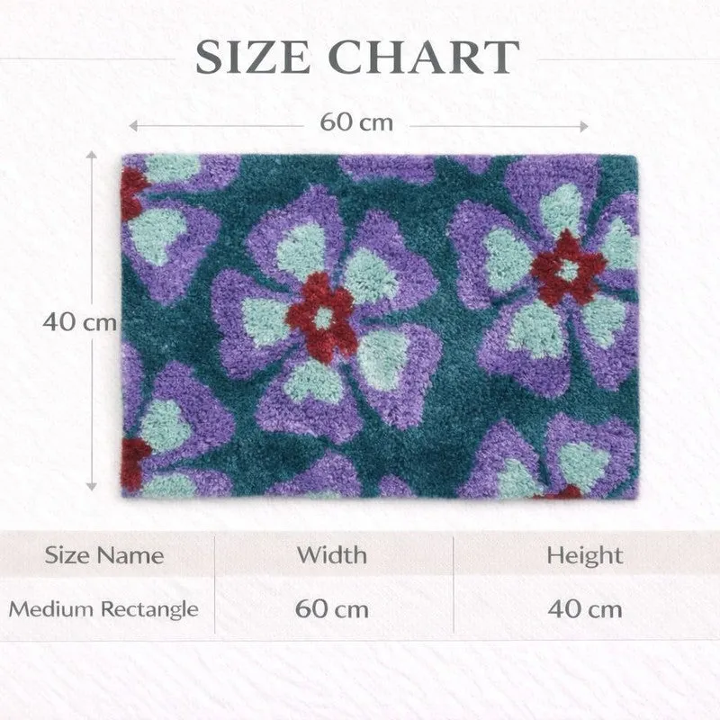 Rectangular floral bath mat shown with printed size chart image