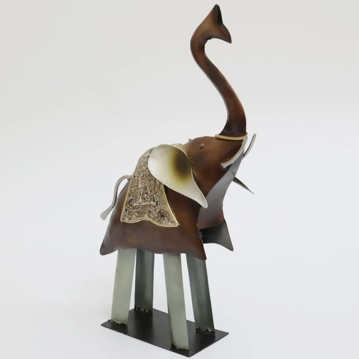 Side view of a brown metal elephant showpiece with cream and grey details