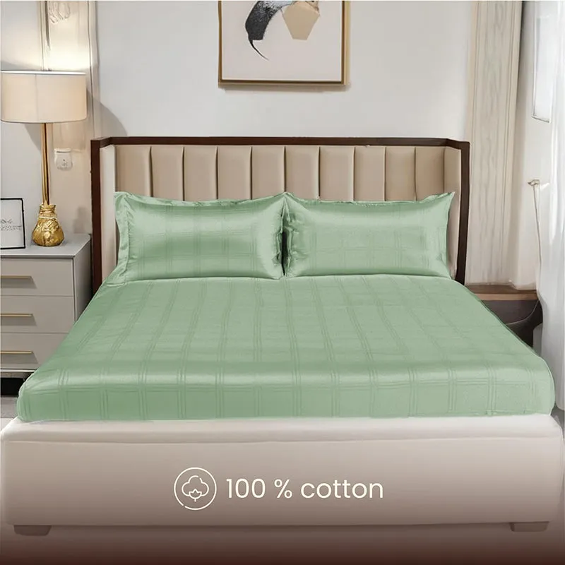 Front view of sage green checked bedsheet set with matching pillow covers