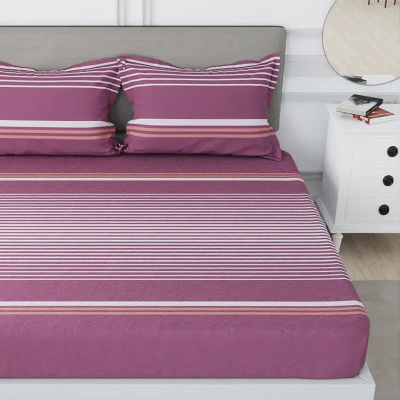 Close view of maroon striped bedsheet spread on bed