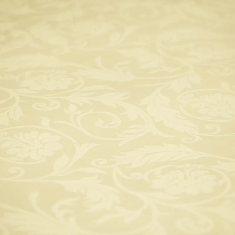 Close-up of the ivory floral jacquard pattern on the duvet cover