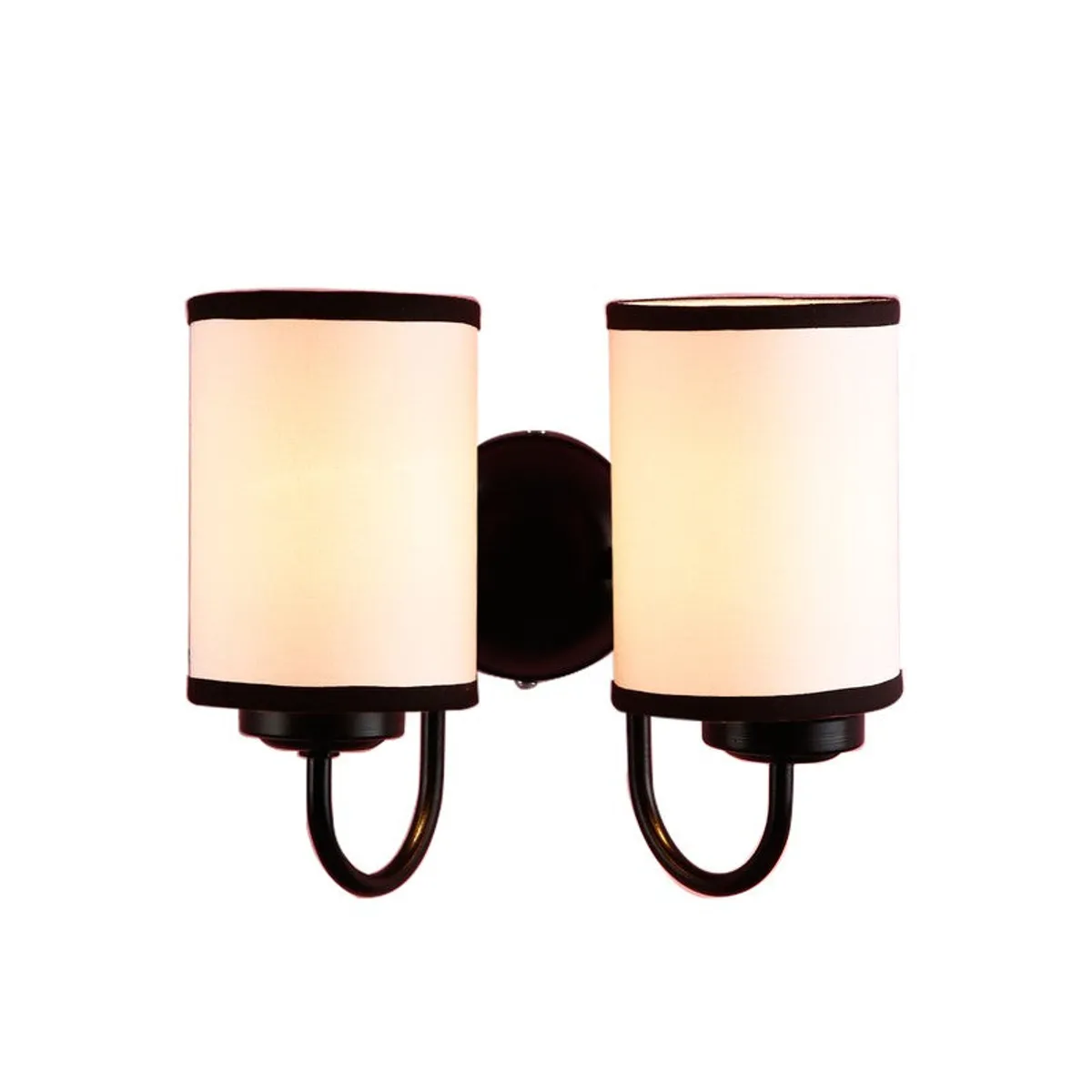 Lit dual wall lamp with white cotton shades and dark iron frame