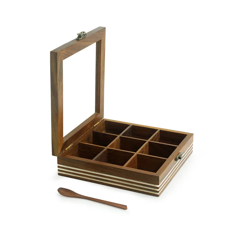Open brown wooden spice box showing divided compartments and spoon