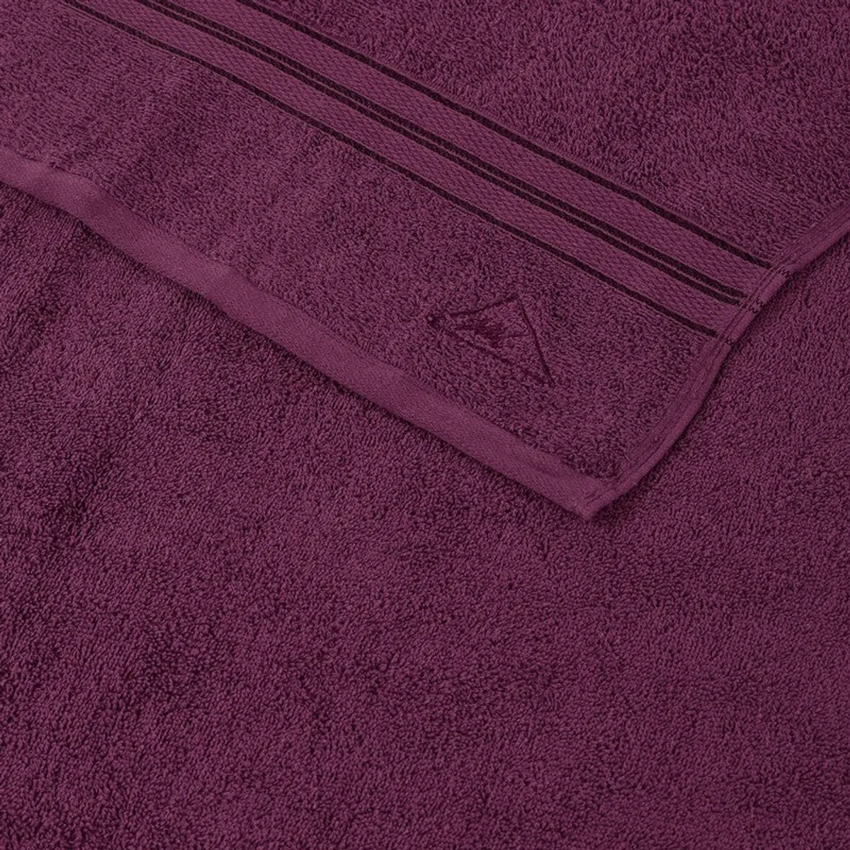 Close-up view of the towel's soft textured surface and decorative border