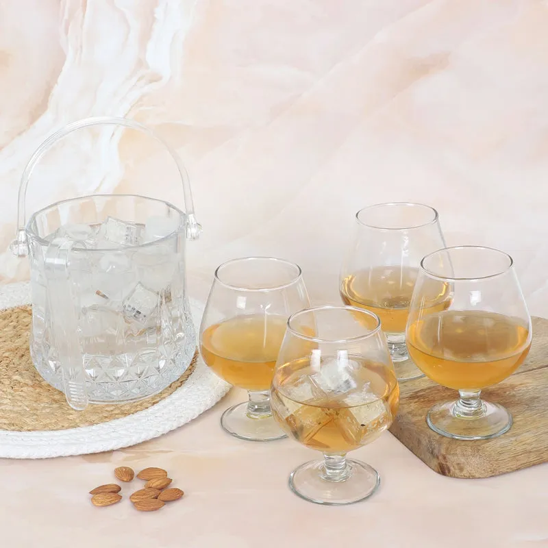Textured glass ice bucket with four rounded stemmed glasses