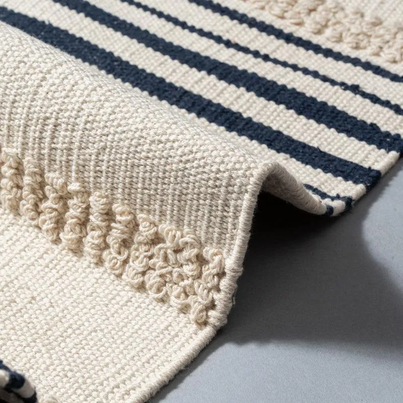 Close-up of the runner's cream textured surface and dark horizontal stripes