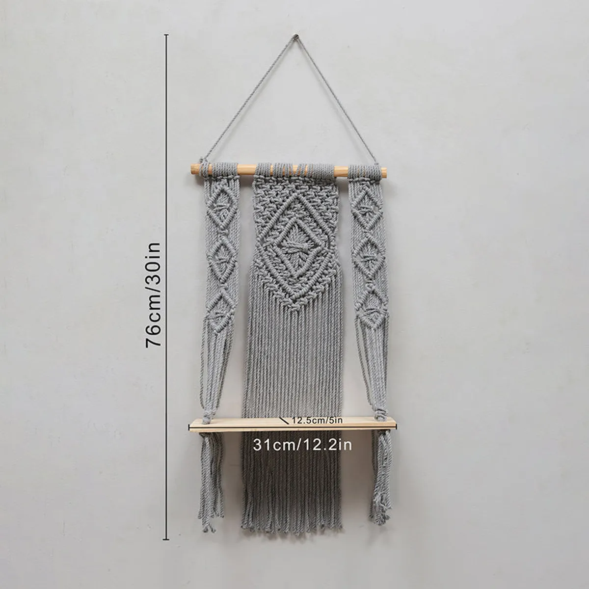 Grey macrame wall shelf shown with dimensional view
