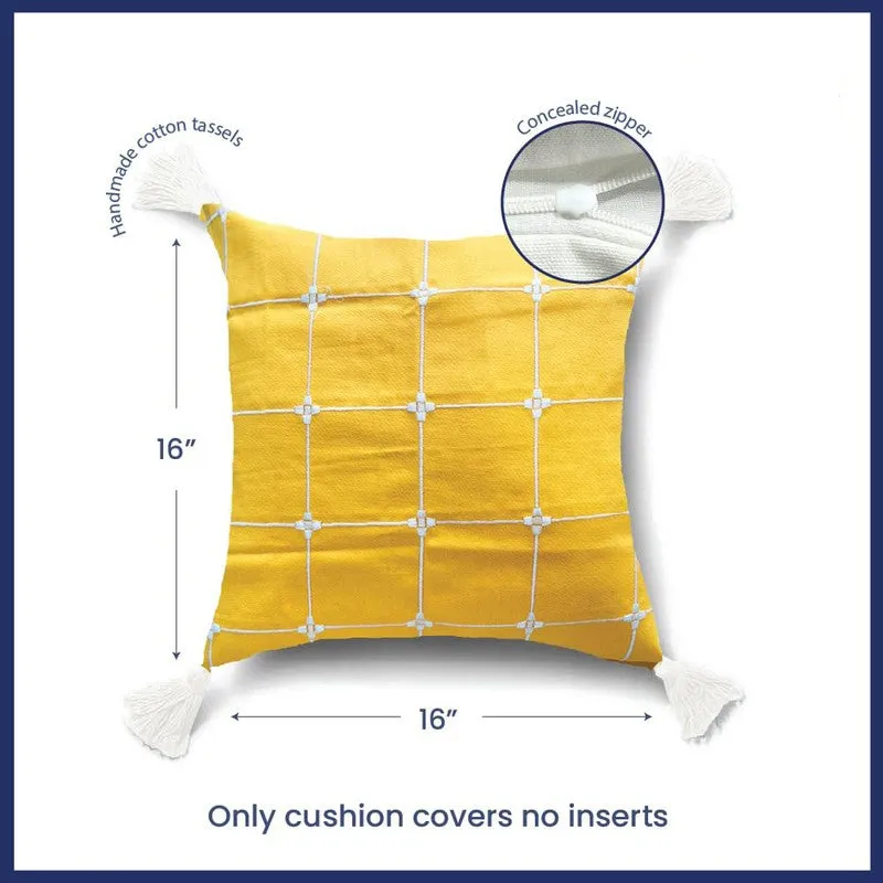 Single yellow square cushion cover with white grid pattern and corner tassels
