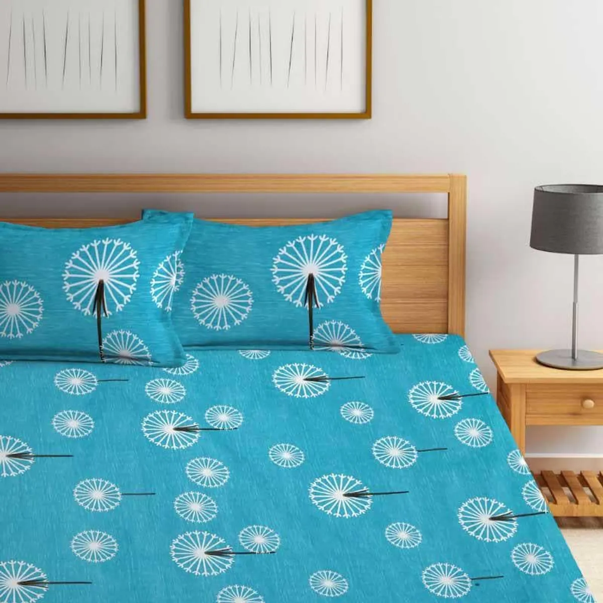 Blue dandelion-print bedsheet styled in a contemporary bedroom